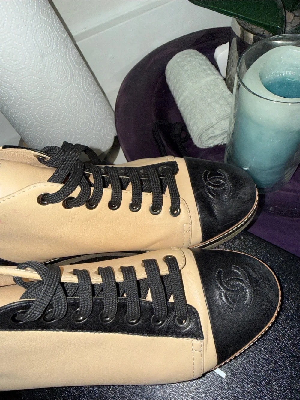 CHANEL Two-Tone Leather High-Top Sneakers in Beige & Black